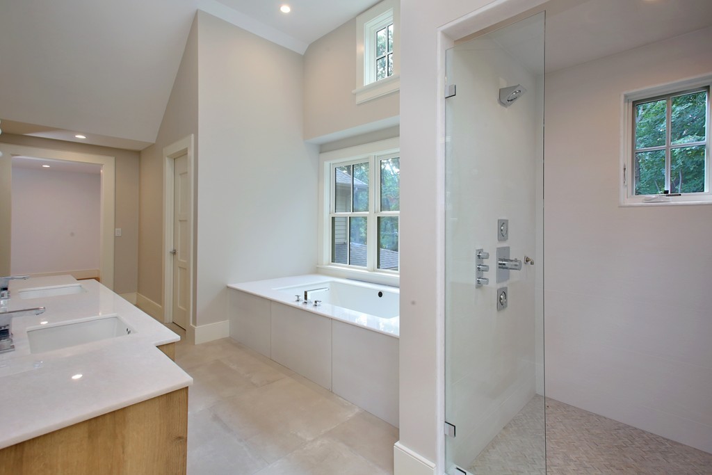 135 Neshobe Road Newton, MA 02468 - Photo 13 of 15 a spacious bathroom with a tub sink and mirror