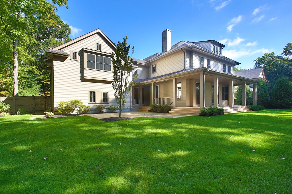 135 Neshobe Road Newton, MA 02468 - Photo 14 of 15 a view of a house with a big yard potted plants and large tree