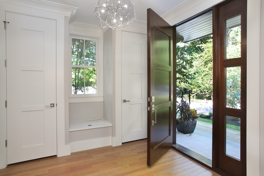 135 Neshobe Road Newton, MA 02468 - Photo 4 of 15 a view of a hallway with wooden floor and windows