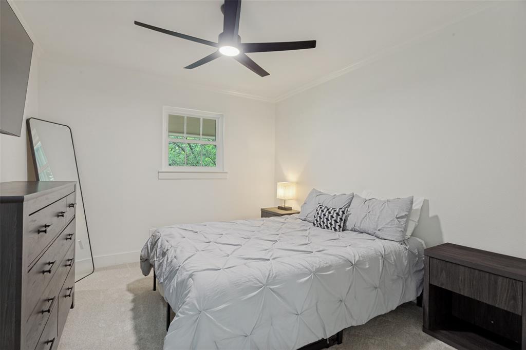 4316 Springbranch Drive Benbrook, TX 76116 - Photo 27 of 39 Carpeted room featuring a ceiling fan, white trim, and a window with natural light