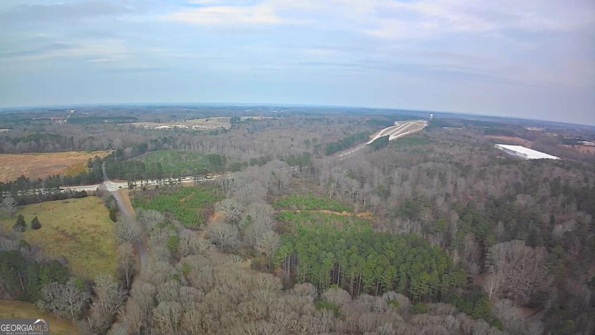 884 Jackson Trail Road Winder, GA 30680 - Photo 18 of 19 a view of a lake and mountain in back