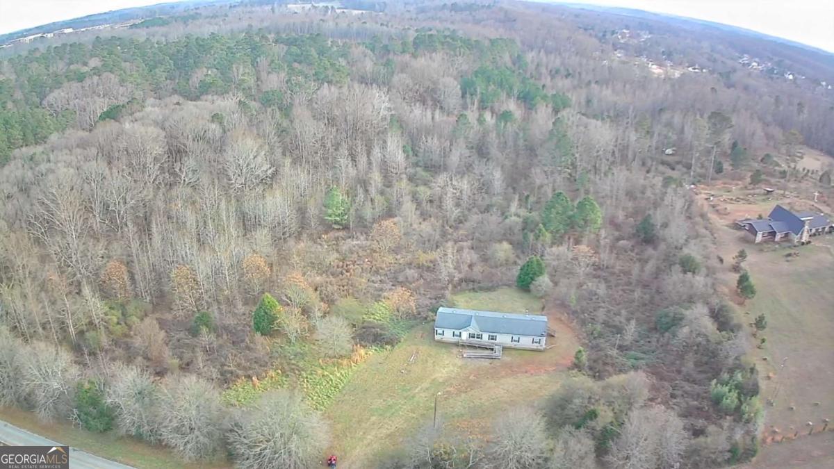 884 Jackson Trail Road Winder, GA 30680 - Photo 10 of 19 a view of a dry yard with trees