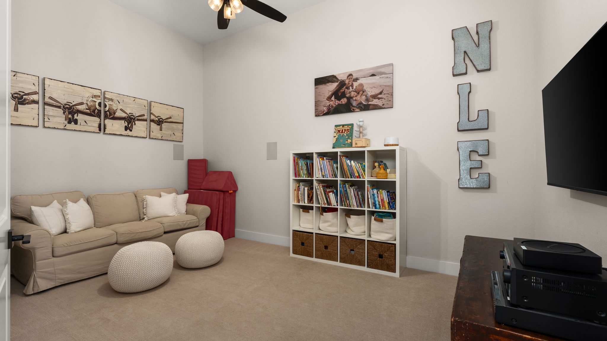 645 Two Creeks Lane Austin, TX 78737 - Photo 12 of 37 a living room with furniture and a flat screen tv