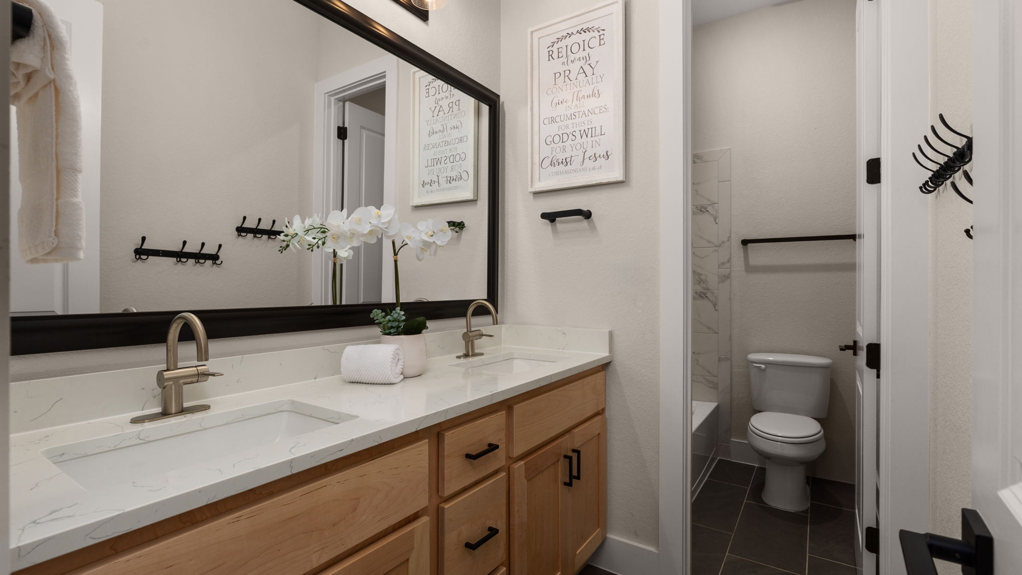 645 Two Creeks Lane Austin, TX 78737 - Photo 15 of 37 a bathroom with a toilet sink and mirror