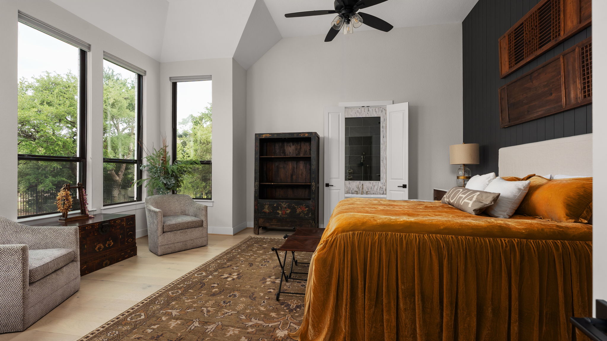 645 Two Creeks Lane Austin, TX 78737 - Photo 18 of 37 a bedroom with a bed and glass windows