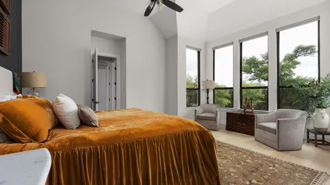 a bedroom with a bed and a couch