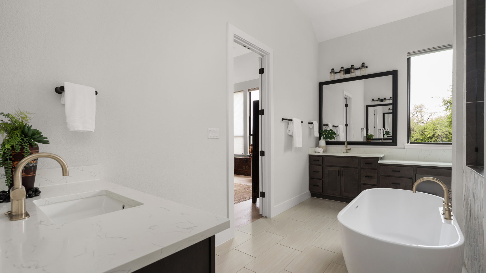 645 Two Creeks Lane Austin, TX 78737 - Photo 20 of 37 a bathroom with a sink and a bathtub