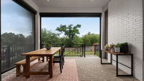 a view of a balcony with furniture