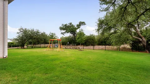 a view of a park with large trees