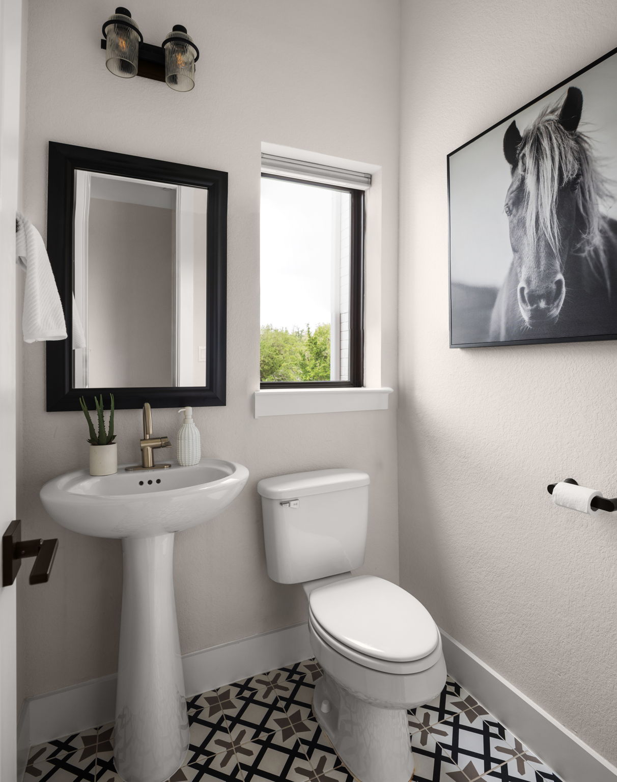 645 Two Creeks Lane Austin, TX 78737 - Photo 3 of 37 a bathroom with a toilet sink and mirror