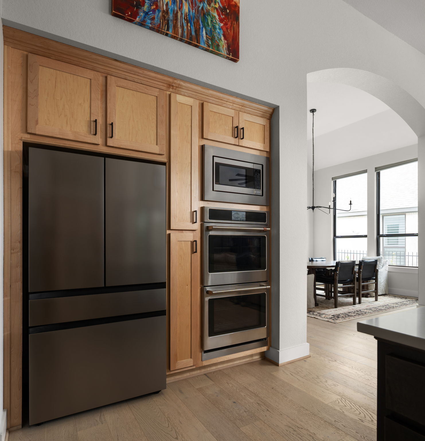 645 Two Creeks Lane Austin, TX 78737 - Photo 5 of 37 a kitchen with granite countertop a refrigerator and cabinets