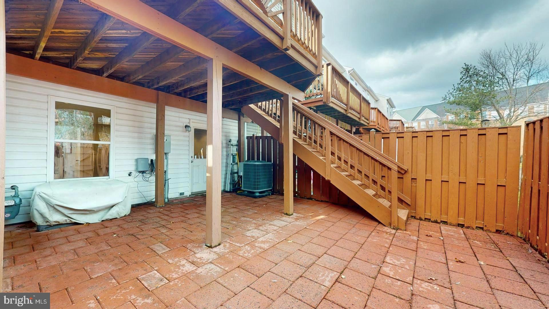 2583 James Madison Circle Herndon, VA 20171 - Photo 25 of 32 Stairs from deck to patio is so convenient to have