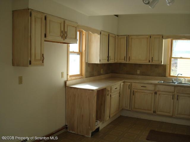 West Nicholson Road Tunkhannock, PA 18657 - Photo 3 of 6 a kitchen with stainless steel appliances granite countertop a sink a stove and a refrigerator