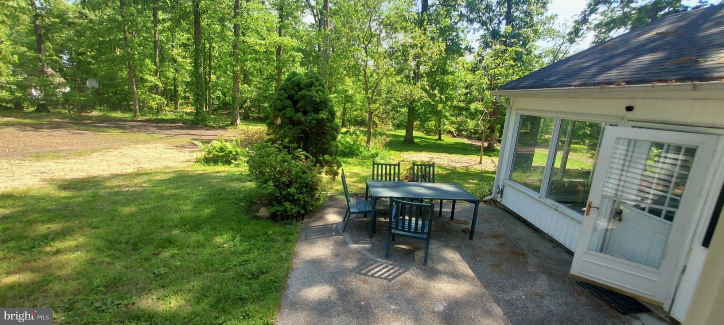 504 Swartley Road Hatfield, PA 19440 - Photo 21 of 32 a view of a patio with chair and table