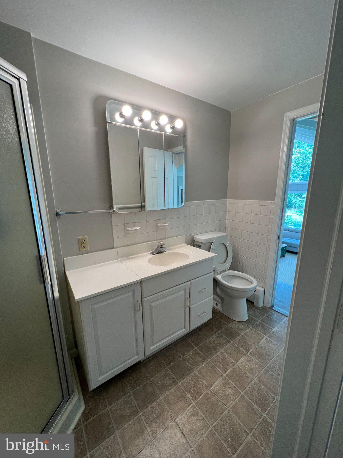 504 Swartley Road Hatfield, PA 19440 - Photo 22 of 32 a bathroom with a double vanity sink mirror and toilet