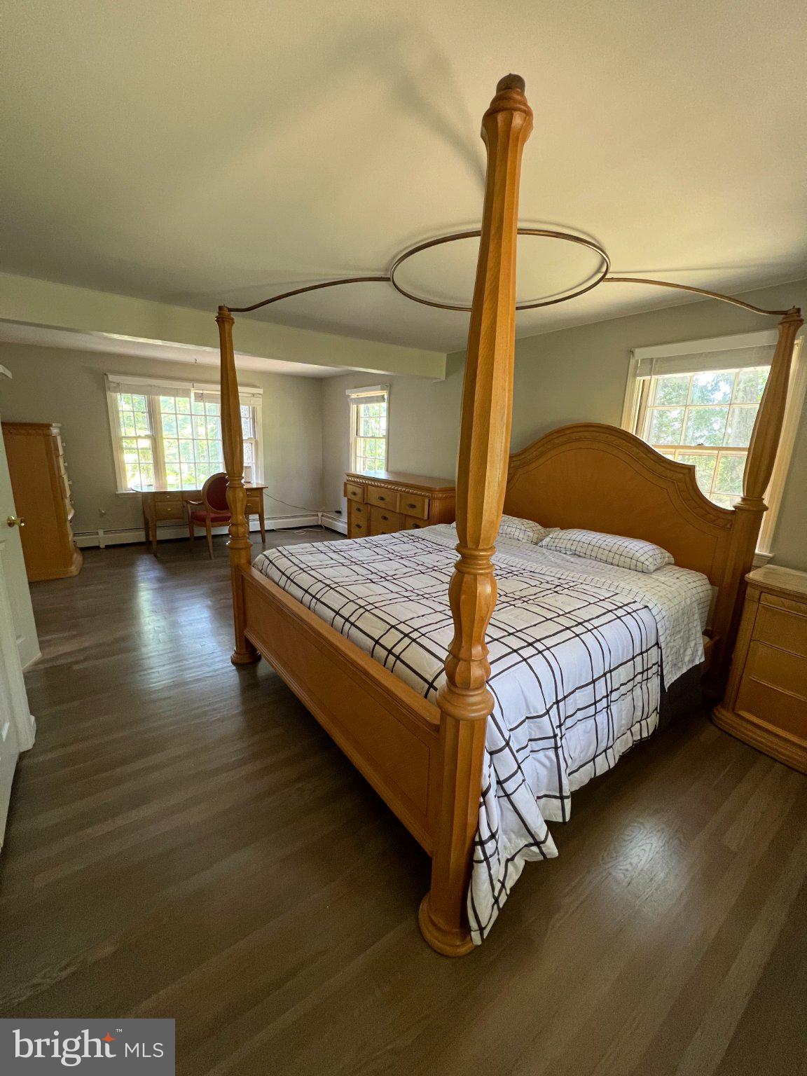504 Swartley Road Hatfield, PA 19440 - Photo 23 of 32 a bedroom with a bed and wooden floor