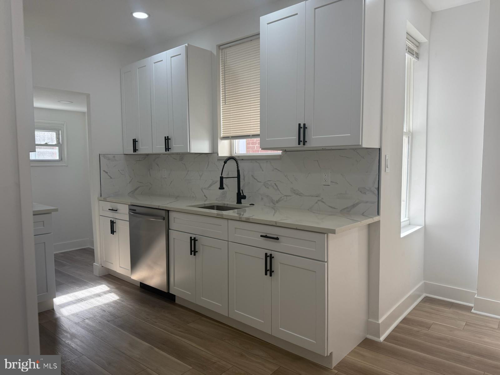 894 Sanger Street Philadelphia, PA 19124 - Photo 11 of 35 a kitchen with stainless steel appliances granite countertop a sink and cabinets