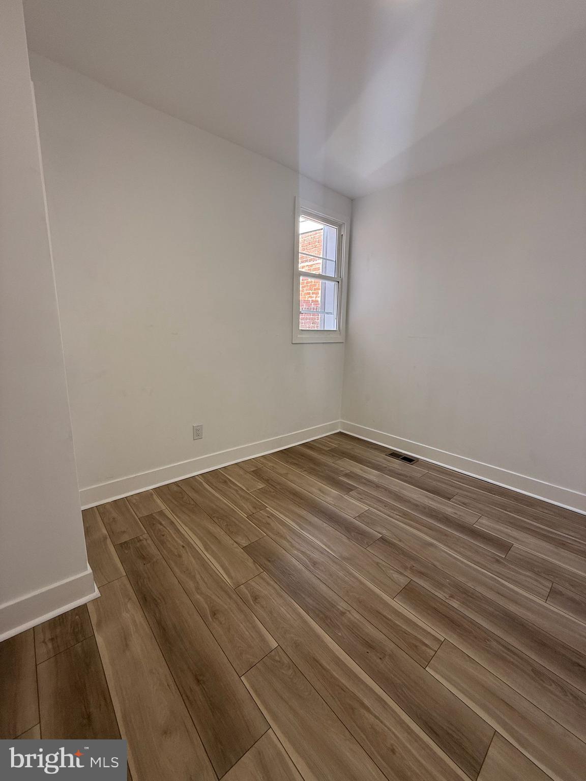 894 Sanger Street Philadelphia, PA 19124 - Photo 16 of 35 a view of a room with wooden floor and fan