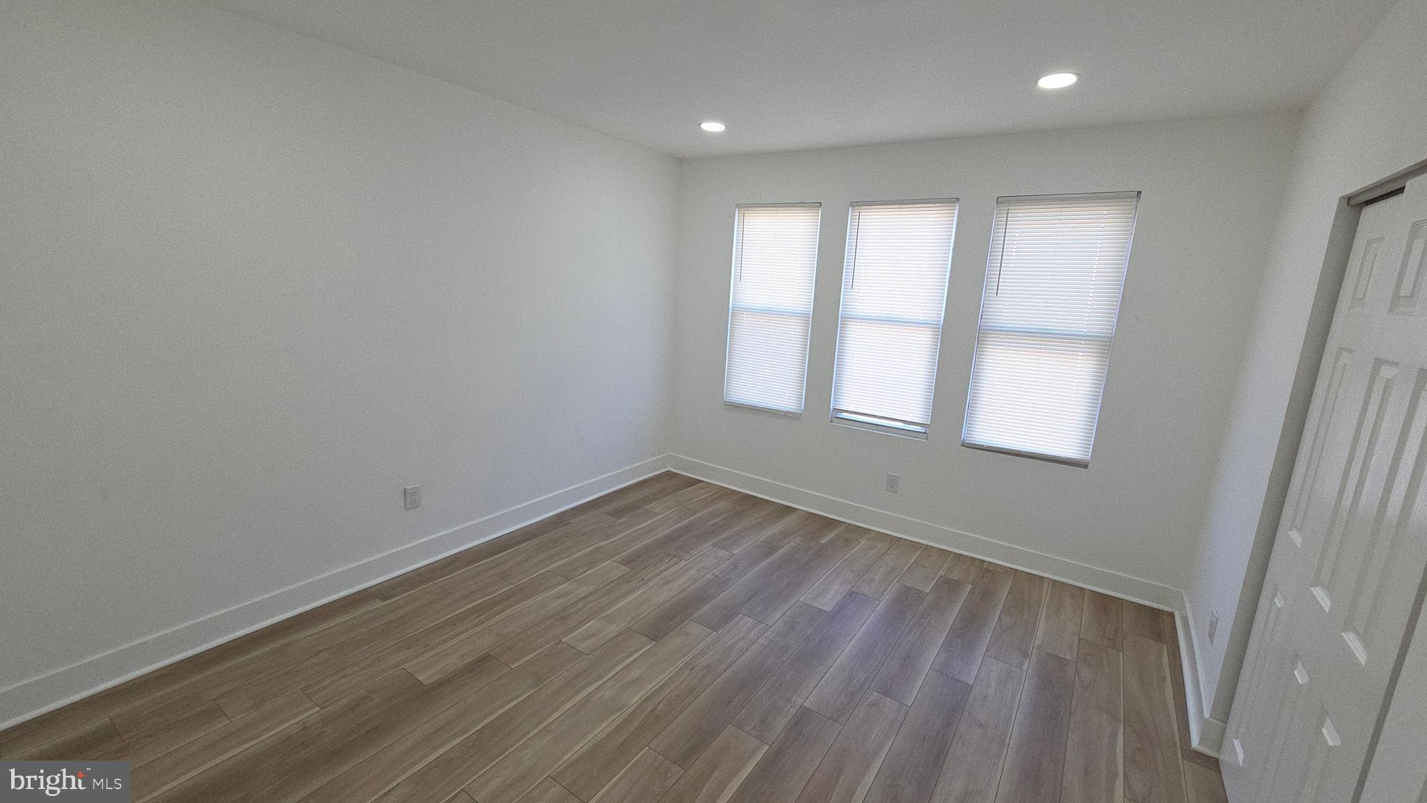 894 Sanger Street Philadelphia, PA 19124 - Photo 18 of 35 wooden floor in an empty room with a window