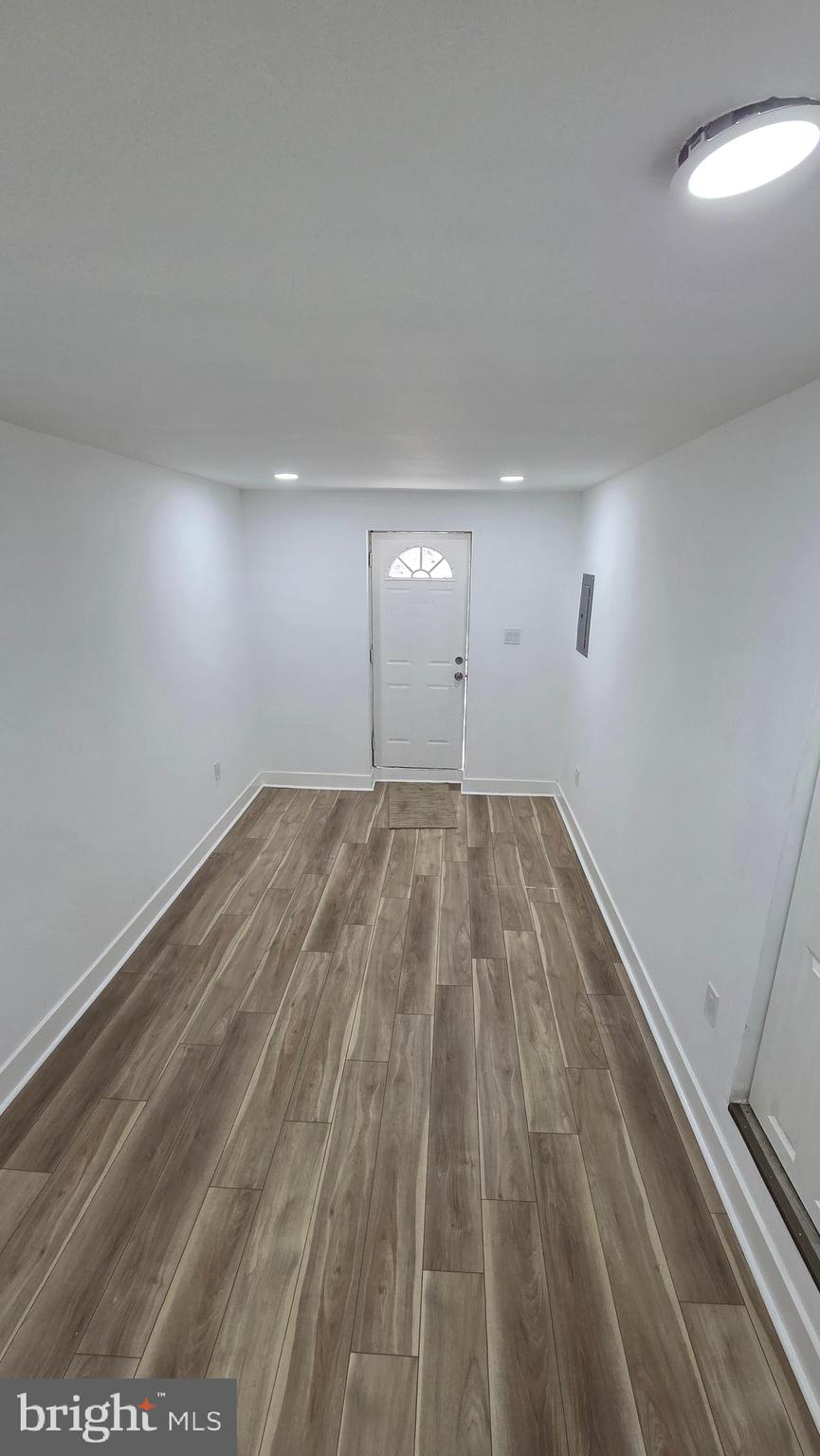 894 Sanger Street Philadelphia, PA 19124 - Photo 31 of 35 a view of empty room with wooden floor