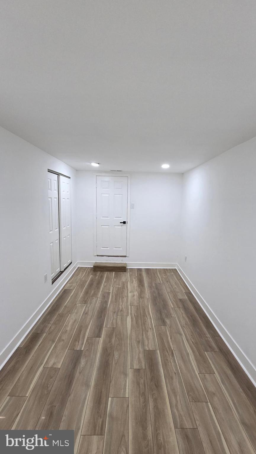 894 Sanger Street Philadelphia, PA 19124 - Photo 32 of 35 a view of empty room with wooden floor
