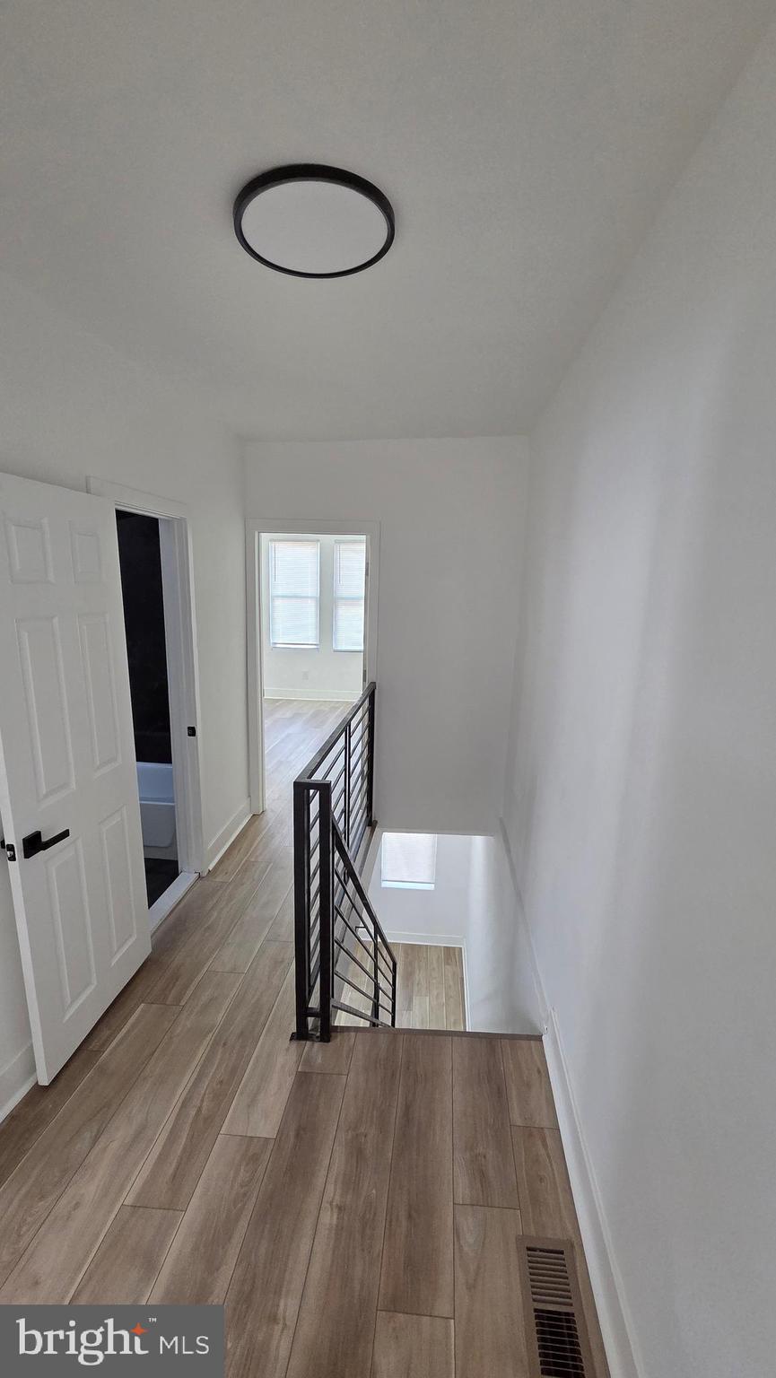 894 Sanger Street Philadelphia, PA 19124 - Photo 33 of 35 a view of a room with wooden floor and chairs