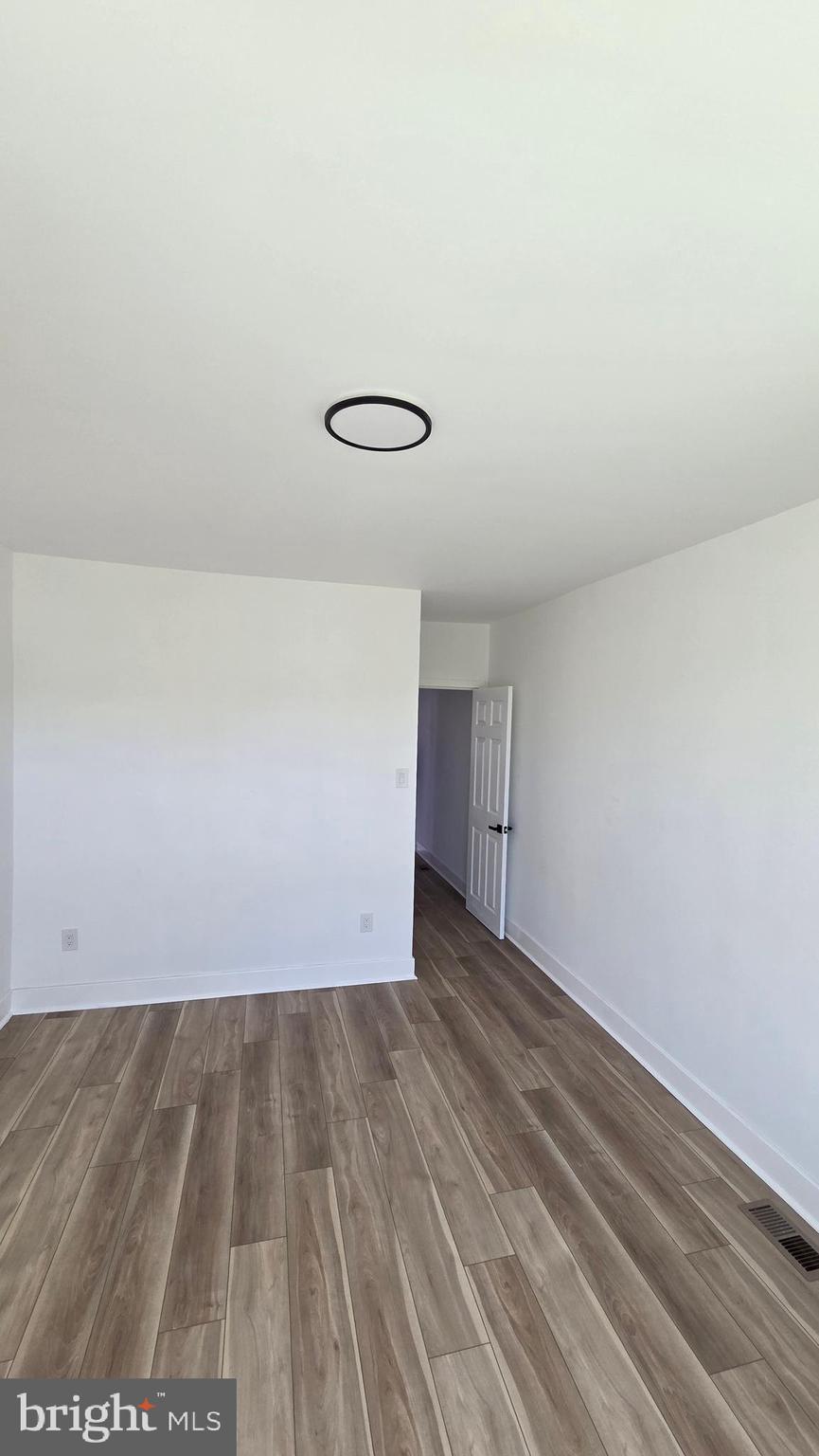 894 Sanger Street Philadelphia, PA 19124 - Photo 34 of 35 a view of room with wooden floor