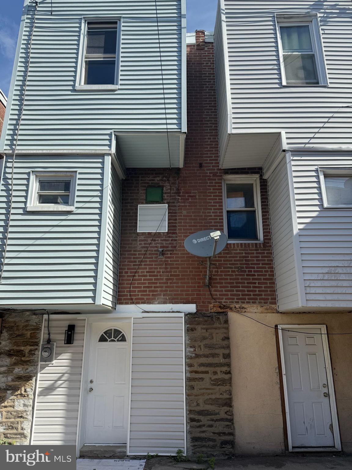 894 Sanger Street Philadelphia, PA 19124 - Photo 35 of 35 a view of a house with more windows and brick wall