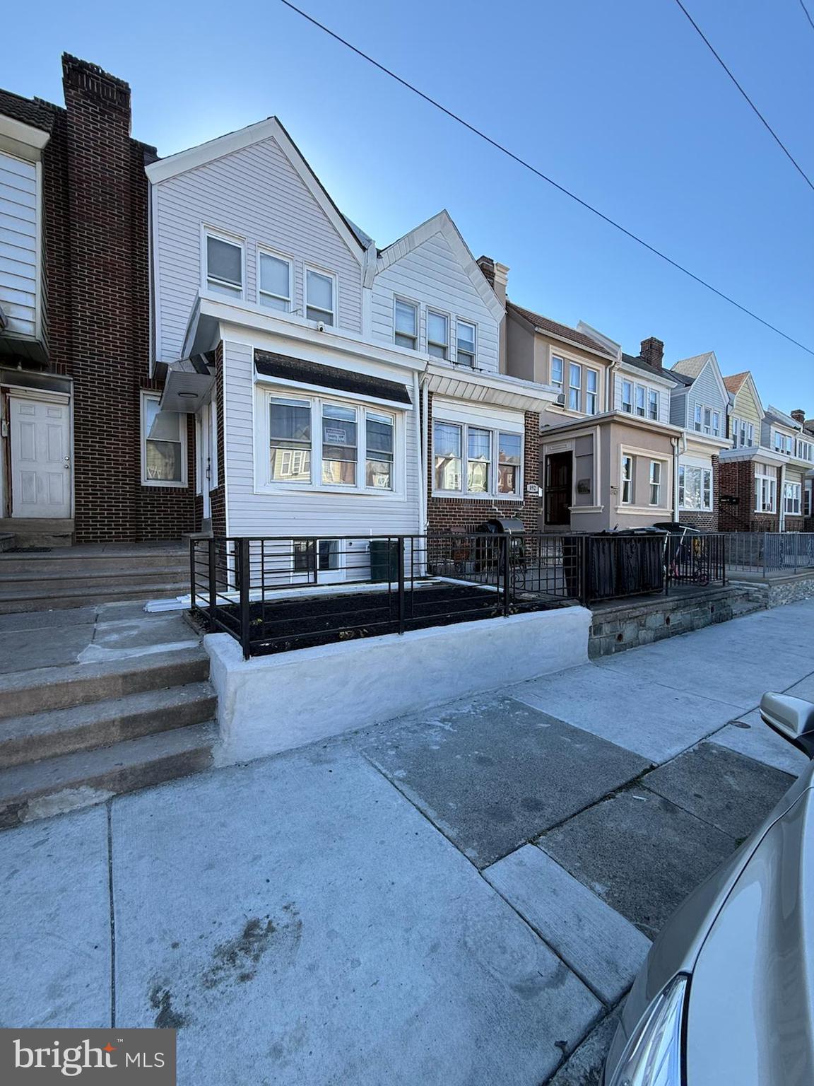 894 Sanger Street Philadelphia, PA 19124 - Photo 5 of 35 a front view of a house with a yard