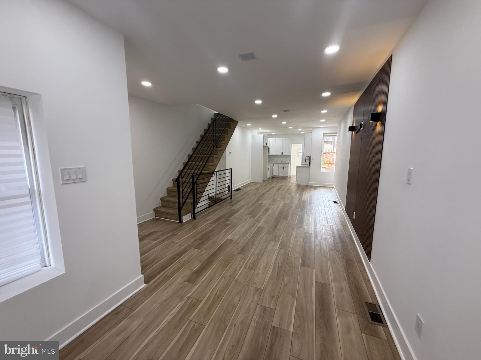 894 Sanger Street Philadelphia, PA 19124 - Photo 6 of 35 a view of a hallway with wooden floor