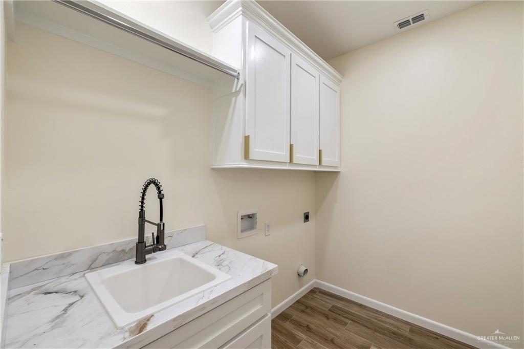 1602 Helen Drive Weslaco, TX 78596 - Photo 19 of 32 a bathroom with a sink and vanity