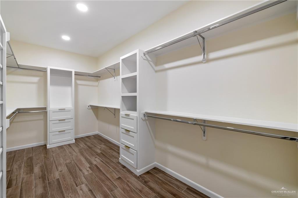 1602 Helen Drive Weslaco, TX 78596 - Photo 23 of 32 a walk in closet with wooden floor