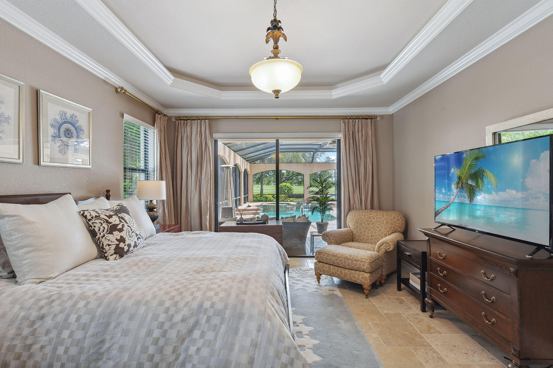 3441 Runaway Lane Naples, FL 34114 - Photo 13 of 50 a bedroom with a large bed and a flat screen tv