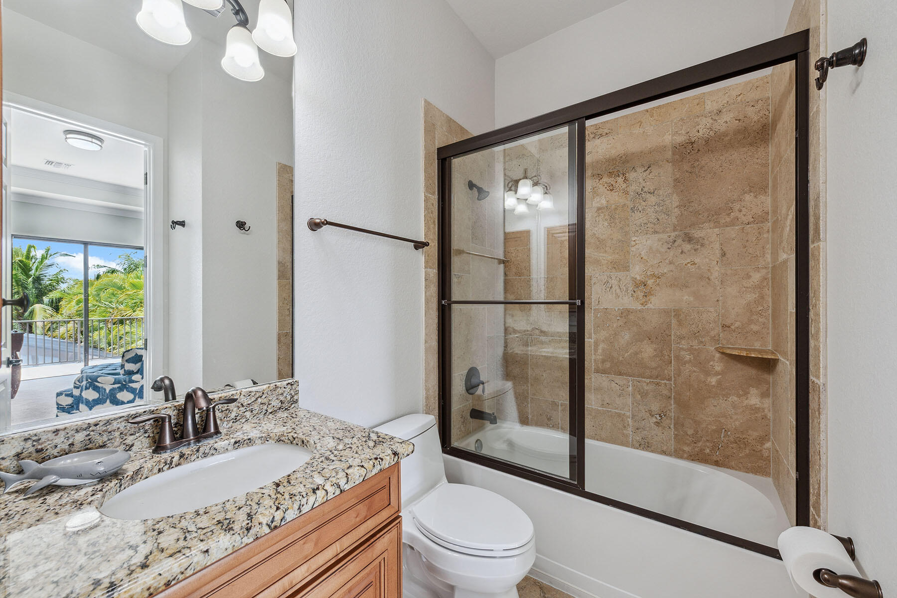 3441 Runaway Lane Naples, FL 34114 - Photo 27 of 50 a bathroom with a granite countertop sink toilet and shower