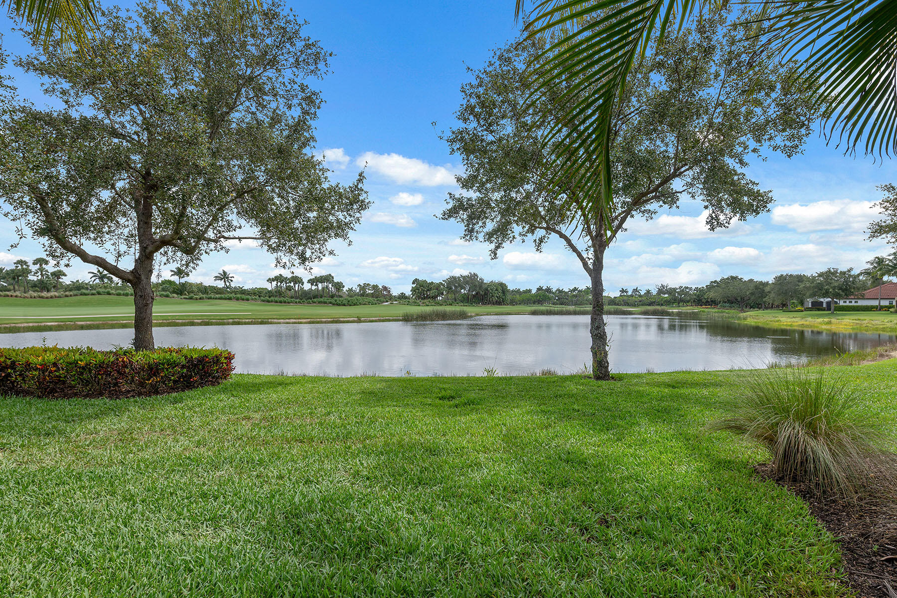 3441 Runaway Lane Naples, FL 34114 - Photo 33 of 50 a view of a lake with a big yard