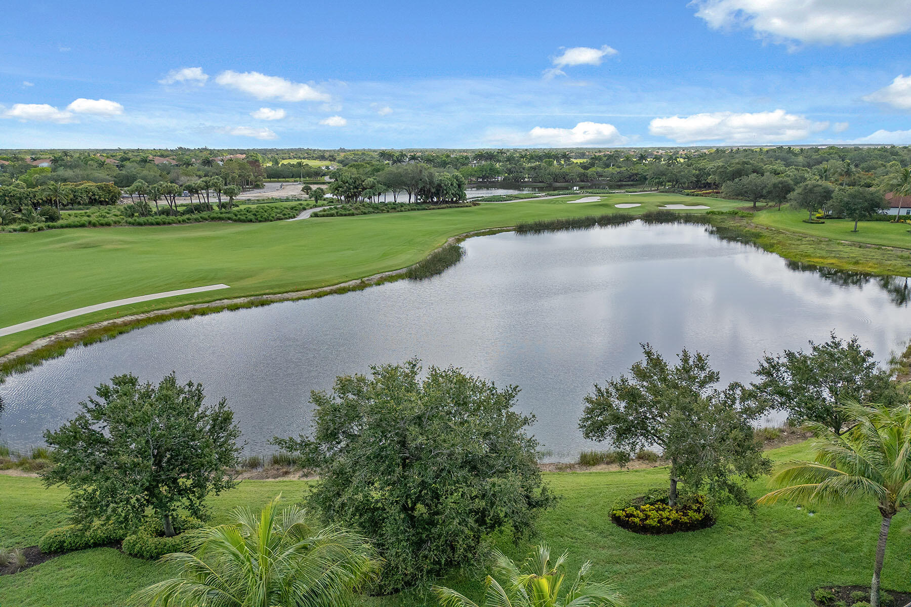 3441 Runaway Lane Naples, FL 34114 - Photo 35 of 50 a view of a lake with a big yard