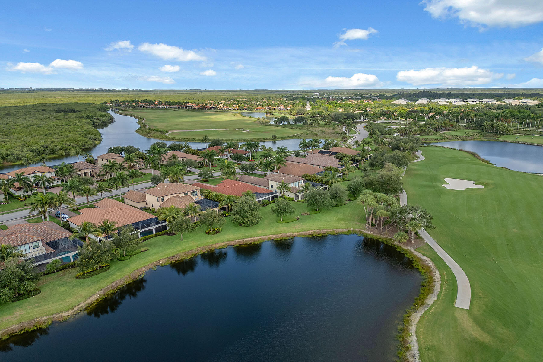 3441 Runaway Lane Naples, FL 34114 - Photo 36 of 50 a view of a lake with a yard