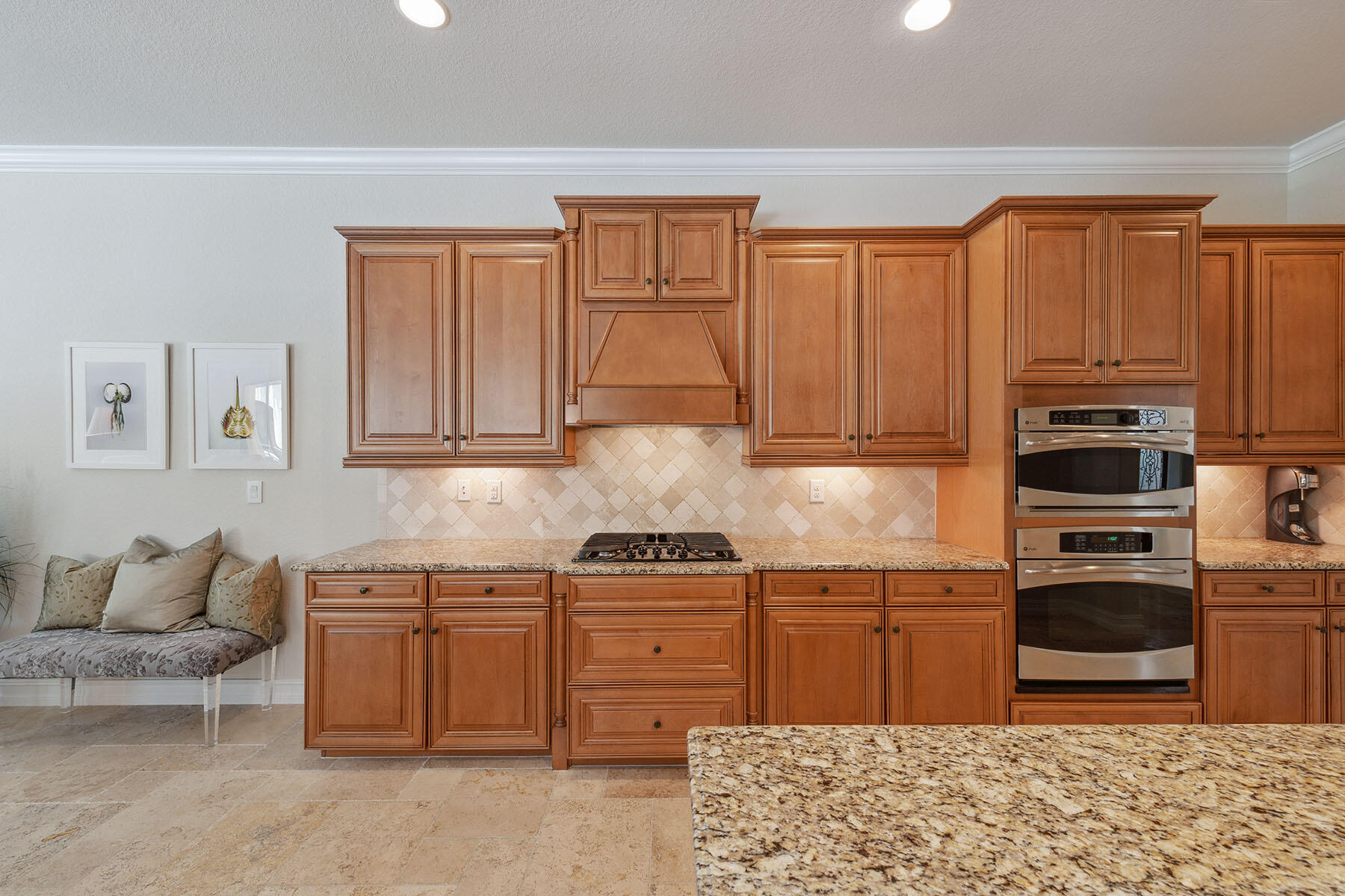 3441 Runaway Lane Naples, FL 34114 - Photo 9 of 50 a kitchen with stainless steel appliances granite countertop a stove top oven a sink dishwasher and wooden cabinets
