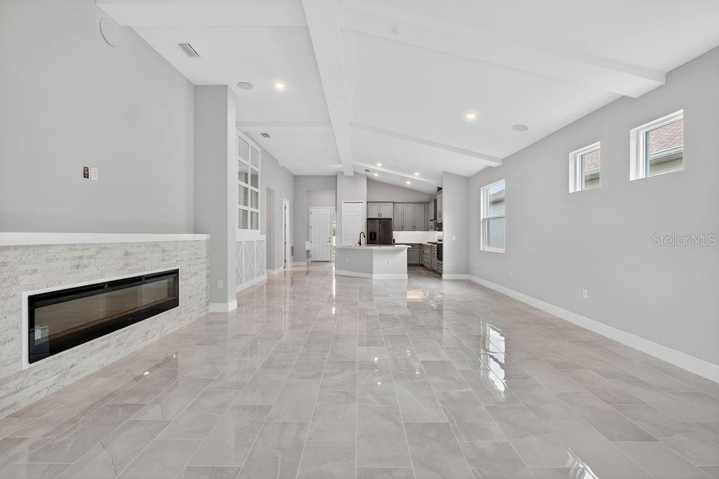 2046 Wallingford Loop Mount Mount Dora, FL 32757 - Photo 14 of 55 a view of kitchen with furniture and fireplace