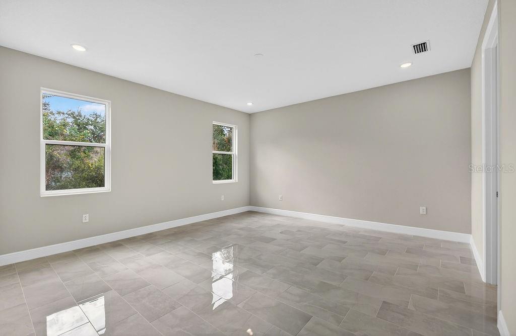 2046 Wallingford Loop Mount Mount Dora, FL 32757 - Photo 17 of 55 an empty room with windows