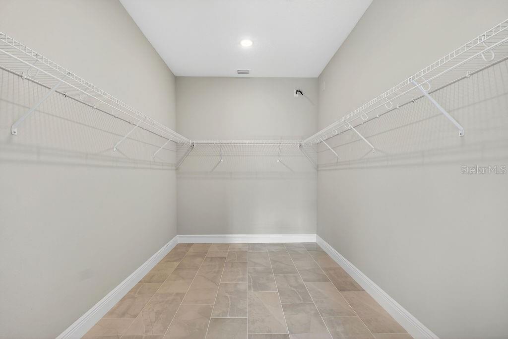 2046 Wallingford Loop Mount Mount Dora, FL 32757 - Photo 21 of 55 a view of a room with racks on the wall