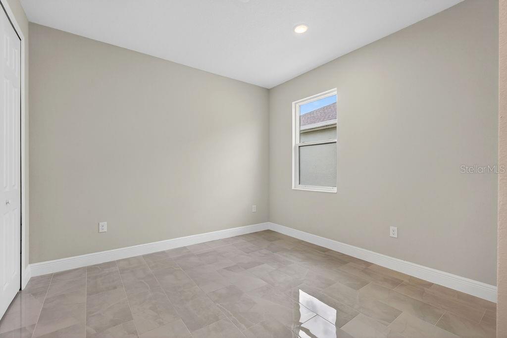 2046 Wallingford Loop Mount Mount Dora, FL 32757 - Photo 26 of 55 an empty room with a hallway