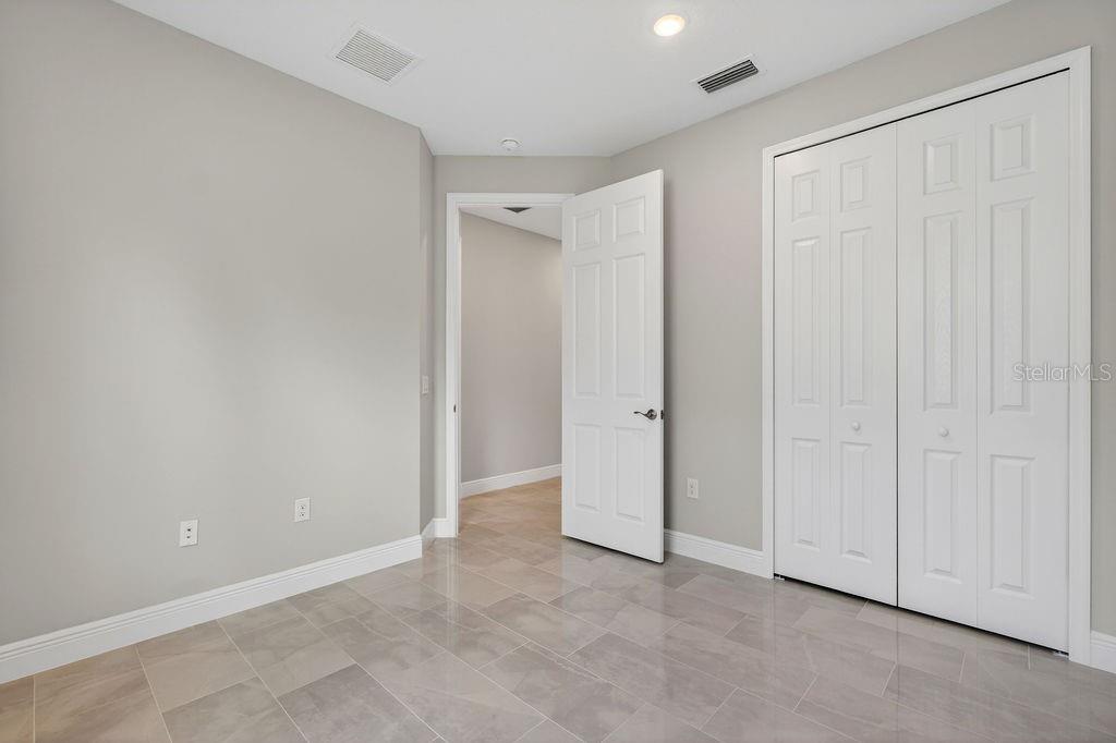 2046 Wallingford Loop Mount Mount Dora, FL 32757 - Photo 27 of 55 an empty room with closet area