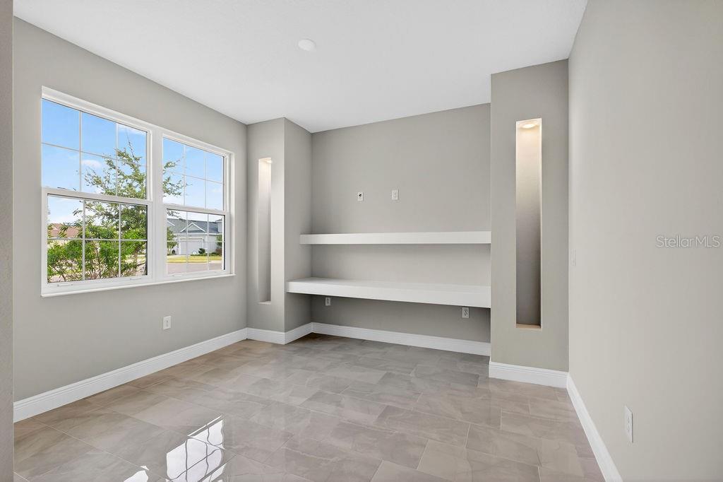2046 Wallingford Loop Mount Mount Dora, FL 32757 - Photo 30 of 55 a view of room with window and workspace