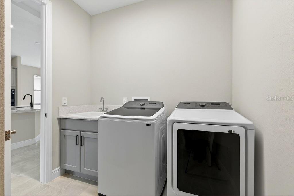 2046 Wallingford Loop Mount Mount Dora, FL 32757 - Photo 32 of 55 a utility room with dryer and washer