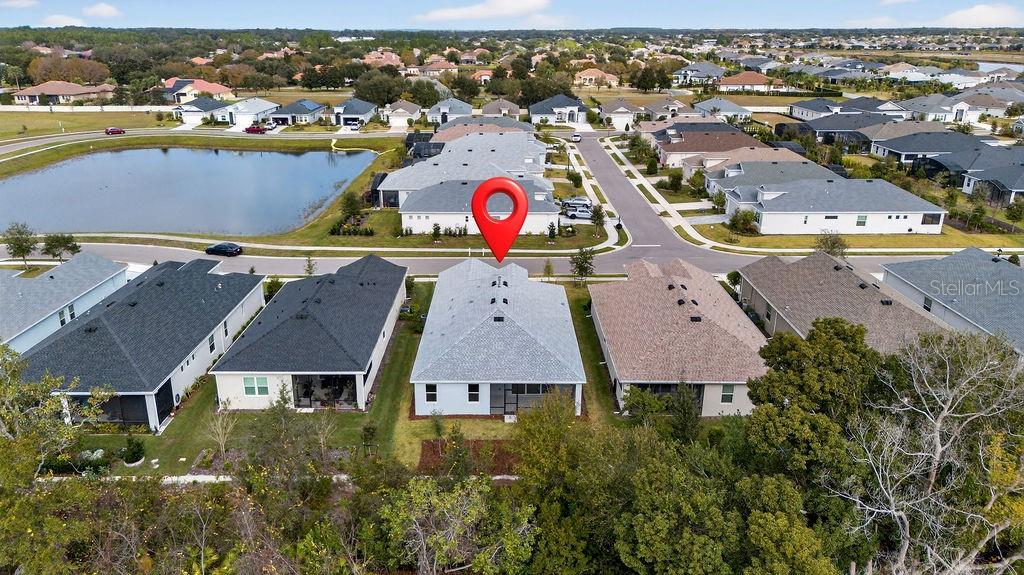 2046 Wallingford Loop Mount Mount Dora, FL 32757 - Photo 39 of 55 an aerial view of residential houses with outdoor space and swimming pool