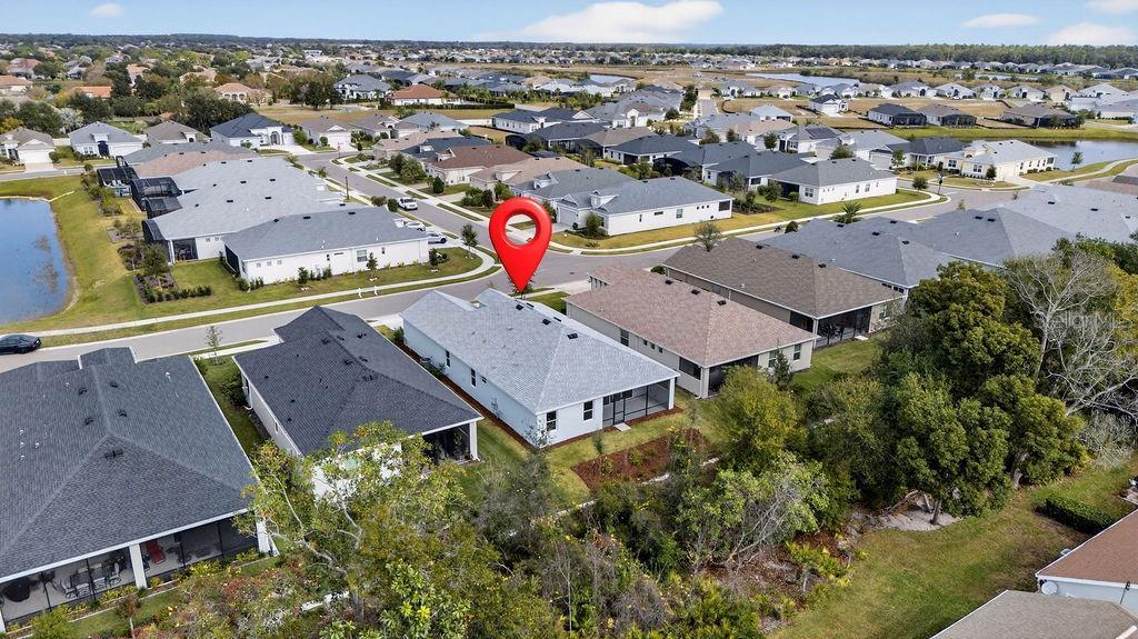 2046 Wallingford Loop Mount Mount Dora, FL 32757 - Photo 40 of 55 an aerial view of a houses with a city