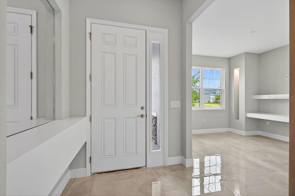 2046 Wallingford Loop Mount Mount Dora, FL 32757 - Photo 6 of 55 an empty room with windows and closet