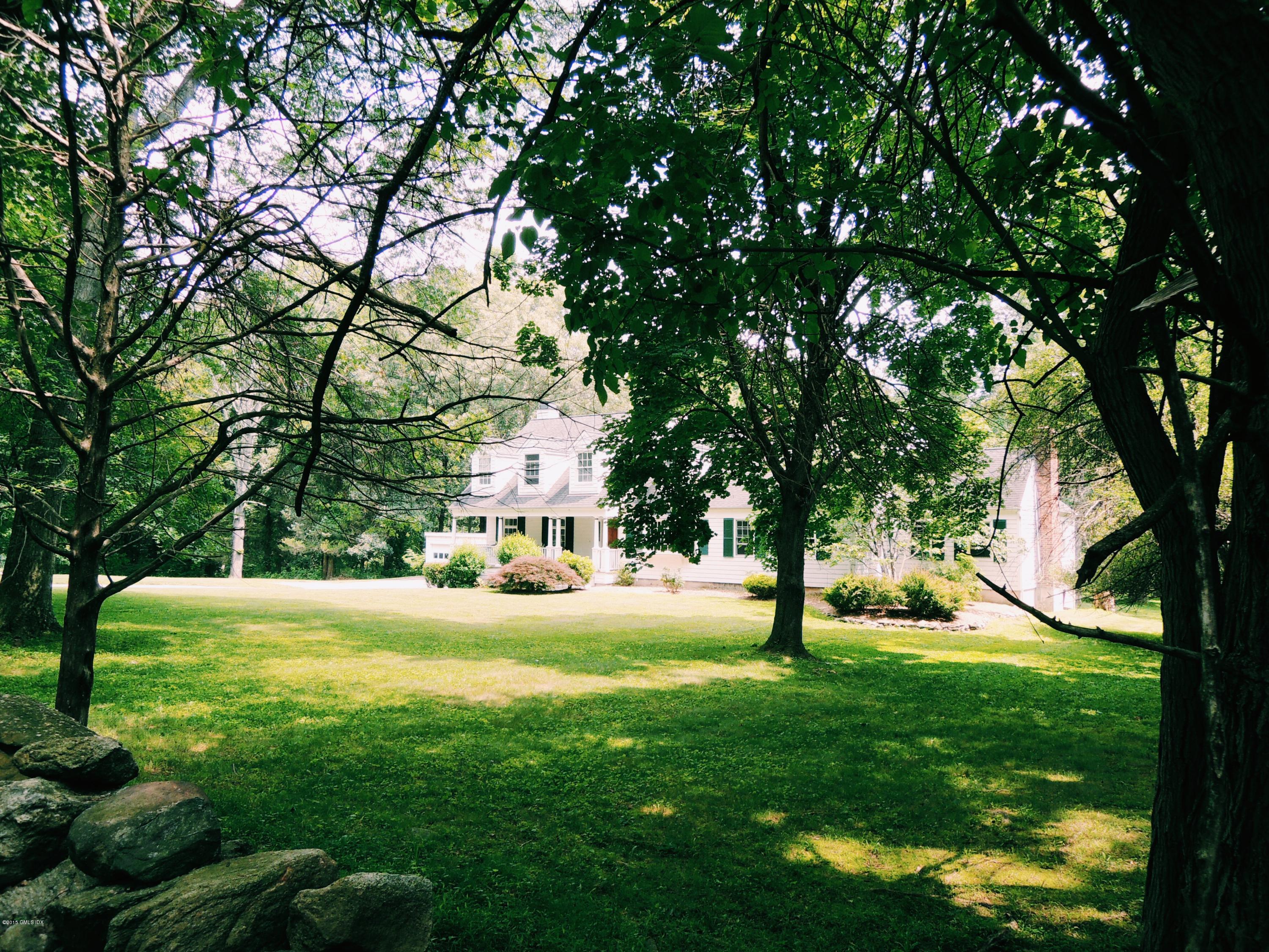 74 Howard Road Greenwich, CT 06831 - Photo 5 of 25 a view of yard with trees