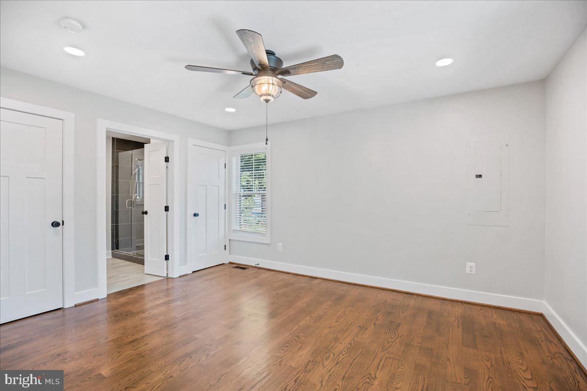 206 Point Lane Solomons, MD 20688 - Photo 23 of 46 an empty room with wooden floor fan and windows